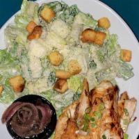 Caesar Salad · Romaine lettuce topped with croutons, parmesan, caesar dressing. Served with anchovies on th...