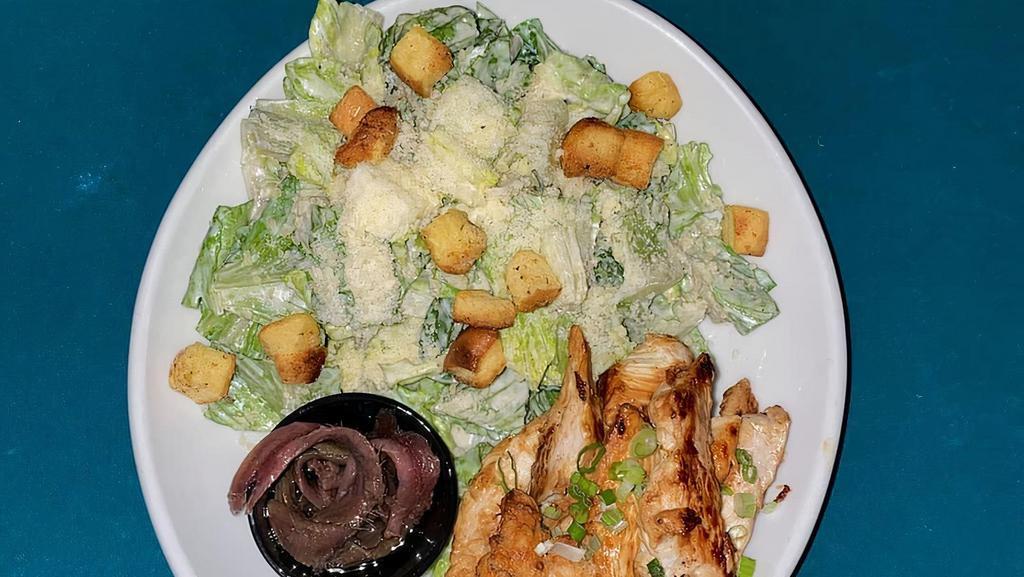 Caesar Salad · Romaine lettuce topped with croutons, parmesan, caesar dressing. Served with anchovies on the side.