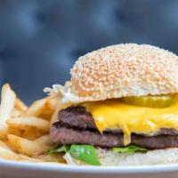 Single Cheese Burger · Angus beef patty cooked to order, topped with American cheese, sautéed onions, lettuce, pick...
