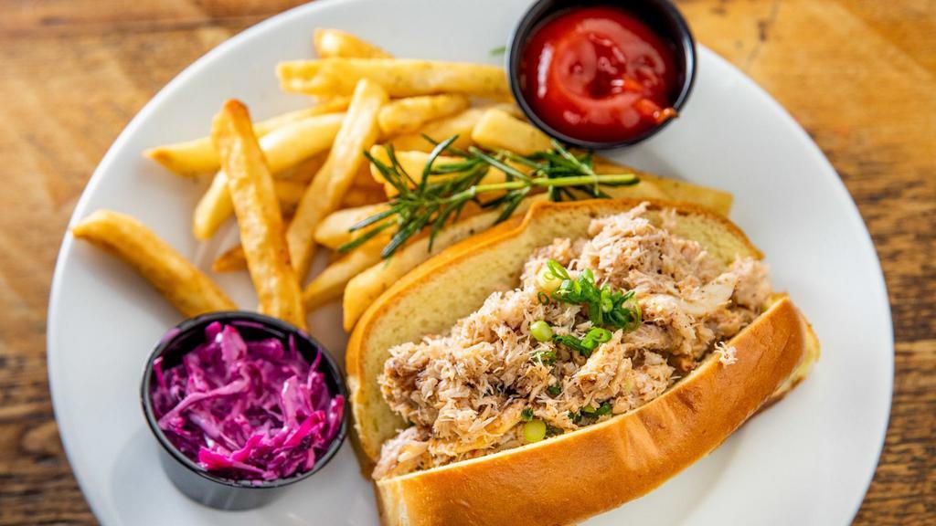 Maryland Crab Roll · Maryland crab on a brioche roll. Served with a side of coleslaw and fries.