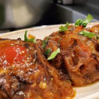 Eggplant Tomato Dip (Patlican Soslu) + 2 Pita · Pan fried cubes of eggplant tossed in roasted bell pepper sauce with lemon juice