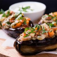 Imam Bayildi Dinner · Baby eggplant stuffed with onions, pine nuts & raisins, drizzled in olive oil.