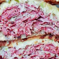 Corned Beef Reuben Sandwich · Made with sauerkraut russian dressing and swiss cheese on a choice of rye bread.