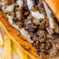 Philly Cheese Steak · Beef sauteed with onions & peppers with melted cheese.