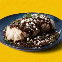 Molé Burrito Burracho · Chicken molé burrito with rice and black beans, topped with molé sauce and cotija cheese
