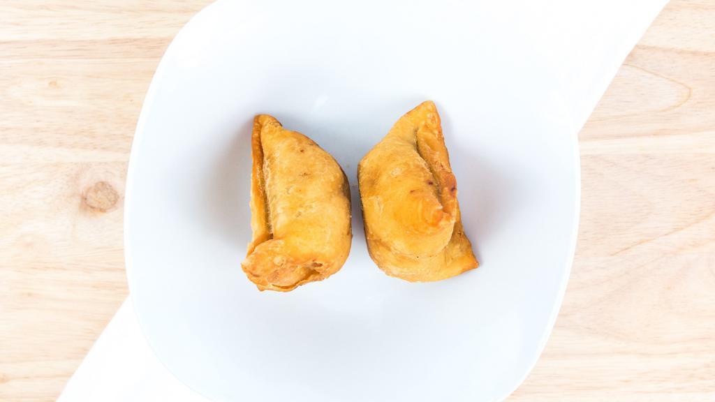 Vegetable Samosa · Vegetarian. Three crispy fried turnovers deliciously filled with mildly spiced potatoes and peas.