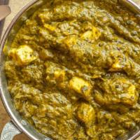Palak Paneer · Fresh homemade Indian cheese gently cooked with garden spinach and mild spices.