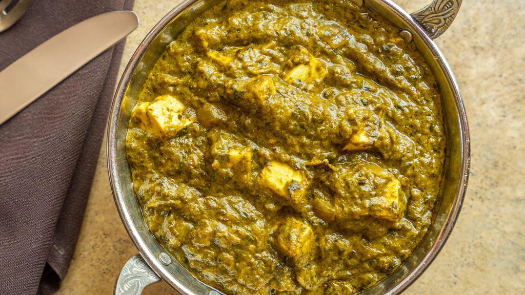 Palak Paneer · Fresh homemade Indian cheese gently cooked with garden spinach and mild spices.