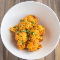 Aloo Gobhi · Fresh cauliflower and potatoes seasoned with Indian spices, cooked to perfection with onions...
