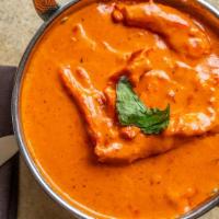 Chicken Makhani · Tandoor baked chicken cooked in oriental spices with tomatoes and butter.