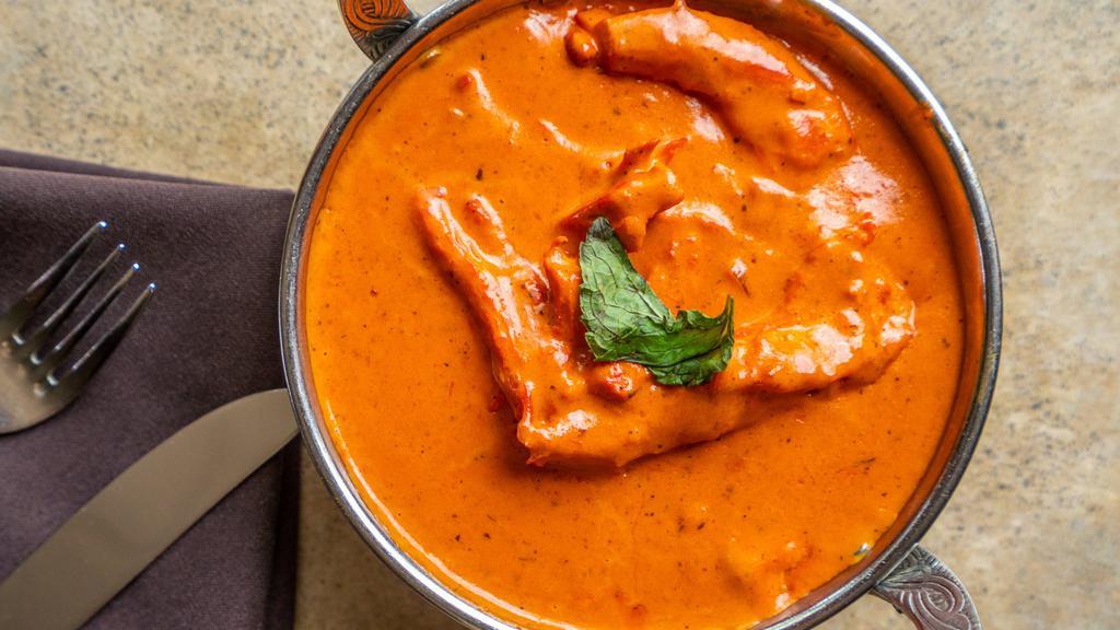 Chicken Makhani · Tandoor baked chicken cooked in oriental spices with tomatoes and butter.