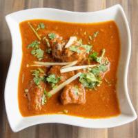 Lamb Rogan Josh · Tender cubes of lamb marinated in eastern spices, sautéed with chopped tomatoes in a mildly ...