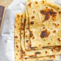 Paratha · Buttered pan-baked, wheat flat bread.