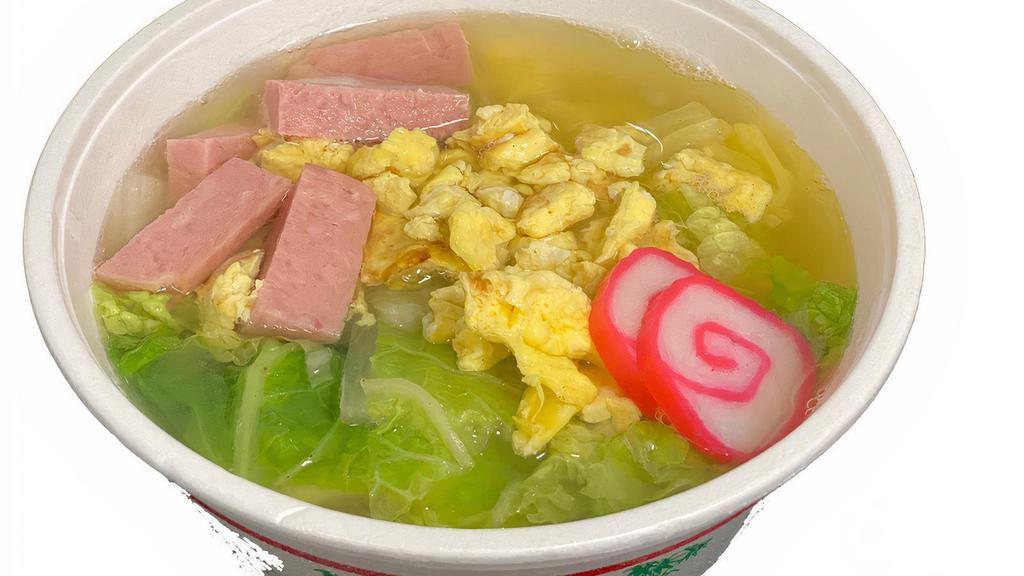 Saimin · Noodles in our homemade dashi. Garnished with spam, chinese cabbage, kamaboko & egg