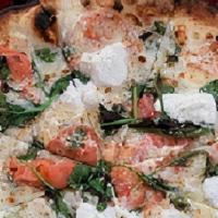 Snowball Pizza · White pizza with ricotta, spinach, sliced tomatoes, mozzarella, garlic and Parmigiano cheese.