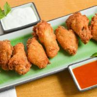 Wings (8) · Chicken wing pieces, seasoned and fried. Choose from several delicious flavors.
