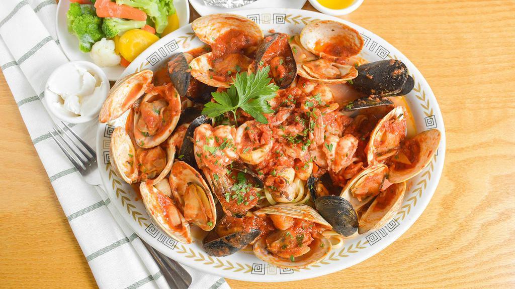 Linguini Zupa Di Mare · Fresh clams and mussels, extra jumbo shrimp, bay scallops and calamari, simmered in a spicy marinara (fra diavolo), red wine or white wine sauce, served over linguini w/ a side salad
