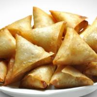 Chicken Samosa · Crispy pastry made with minced chicken, onions, ginger and some spices.