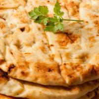 Naan · Bread baked in a clay tandoor oven, great for dipping in the gravy.