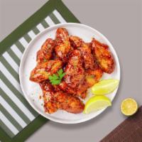 Honey Garlic Wings · Fresh chicken wings breaded, fried until golden brown, and tossed in honey and garlic sauce....
