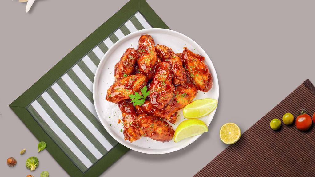 Honey Garlic Wings · Fresh chicken wings breaded, fried until golden brown, and tossed in honey and garlic sauce. Served with a side of ranch or bleu cheese.