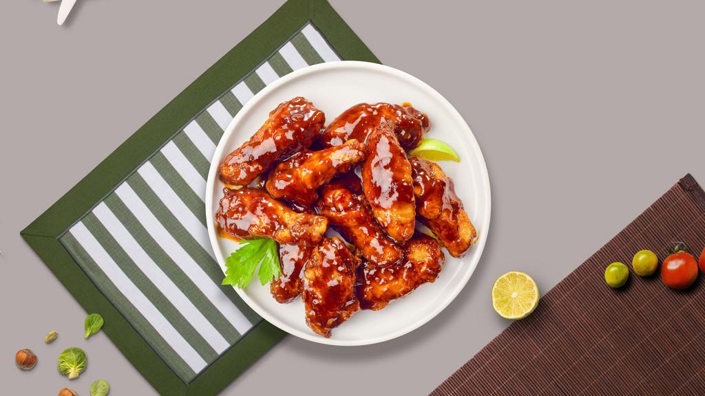 Bbq Wings · Fresh chicken wings breaded, fried until golden brown, and tossed in barbecue sauce. Served with a side of ranch or bleu cheese.