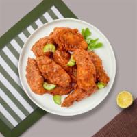 Hot Wings · Fresh chicken wings breaded, fried until golden brown, and tossed in hot sauce. Served with ...