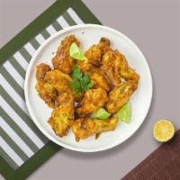 Honey Mustard Wings · Fresh chicken wings breaded, fried until golden brown, and tossed in honey and mustard. Serv...