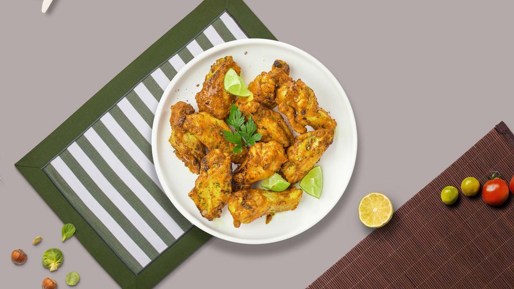 Honey Mustard Wings · Fresh chicken wings breaded, fried until golden brown, and tossed in honey and mustard. Served with a side of ranch or bleu cheese.