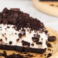 Oreo Cheesecake · Fresh dessert baked with an Oreo crust and topped with white chocolate ganache and whipped c...