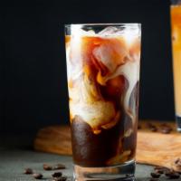 Iced Coffee · Perfectly prepared iced beverage by brewing coffee then serving it over ice.