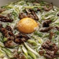 Pho Thin Ha Noi / Wok-Seared Beef Pho · Fresh Cana phở noodles, wok-seared Happy Valley brisket, egg yolk & scallions.