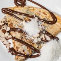 Coconuts And Almonds Crepe · Banana ,Almonds, toasted Coconut flakes, Nutella and Powdered Sugar .