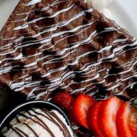 Triple Chocolate Waffle · Waffles are made with milk chocolate drizzled with white and dark chocolate and powdered sug...