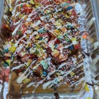 Fruity Pebbles Waffle · Fruity pebbles, strawberry, chocolate and powdered sugar waffles are made with milk chocolat...