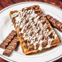 Kinder Waffle  · Kinder sticks and kinder Bueno with milk chocolate drizzled with  dark and white chocolate .