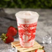 Strawberry Shake · Strawberry ice cream with strawberry syrup drizzled on the cup.
