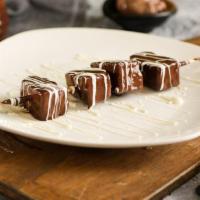 Pineapple Chocolate Dip · Dipped in milk chocolate with white chocolate drizzled on top.