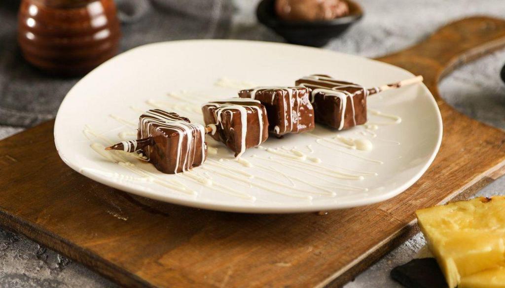 Pineapple Chocolate Dip · Dipped in milk chocolate with white chocolate drizzled on top.