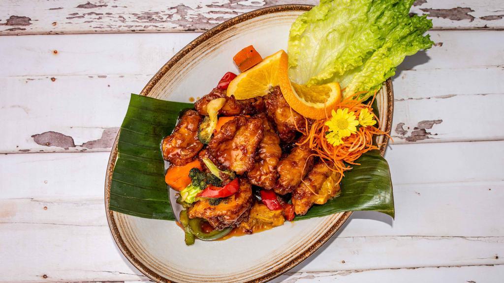 Orange Ginger Chicken · Stir-fried crispy chicken in a rich of orange ginger sauce, broccoli and topped with crispy ginger.