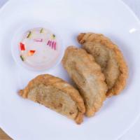 Chicken Curry Puff · Minced chicken, potatoes and onions in pastry served with cucumber sauce.