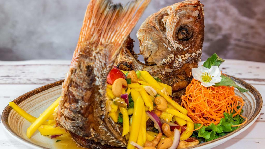 Crispy Red Snapper · Deep-fried whole red snapper with choice of mango salad or three-flavor sauce.