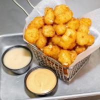 Fried White Cheddar Cheese Curds · Served with house sauce and maple aioli.