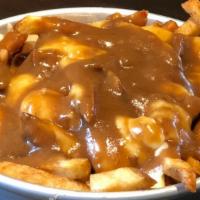 Classic · Crispy house cut fries topped with white cheddar cheese curds and brown gravy.