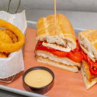 Grandma'S Chicken Sandwich · Breaded chicken cutlets served on a toasted rustic hero, topped with roasted red pepper, fre...