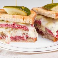 Rick Rubin Sandwich · Corned beef and pastrami topped with sauerkraut, Swiss cheese and Russian dressing. Served o...