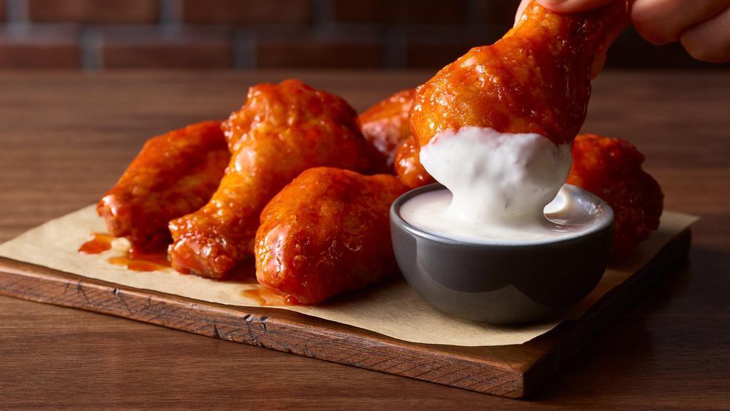 18 Traditional Wings · An order of our classic, crispy bone-in wings covered in your choice of sauce.