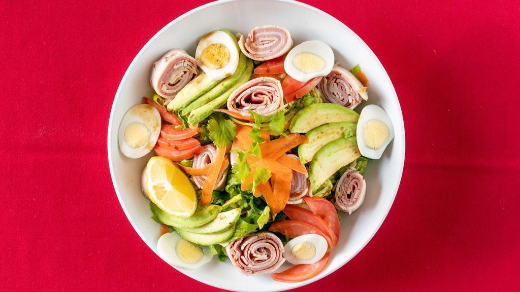 Modern Chef'S Salad · Corned beef and smoked turkey cut into quarter inch, diced ripe avocado, cherry tomatoes, hard boiled eggs over a bed of crispy romaine lettuce. Served with homemade lemon zest dressing.