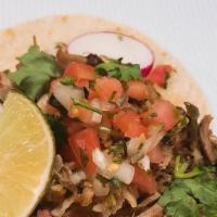 Carnitas Taco · Charbroiled pork in a soft corn tortilla with chopped onions, cilantro and homemade spicy sa...
