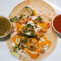 Shrimp Taco · Charbroiled shrimp in a soft corn tortilla with chopped onions, cilantro and homemade spicy ...